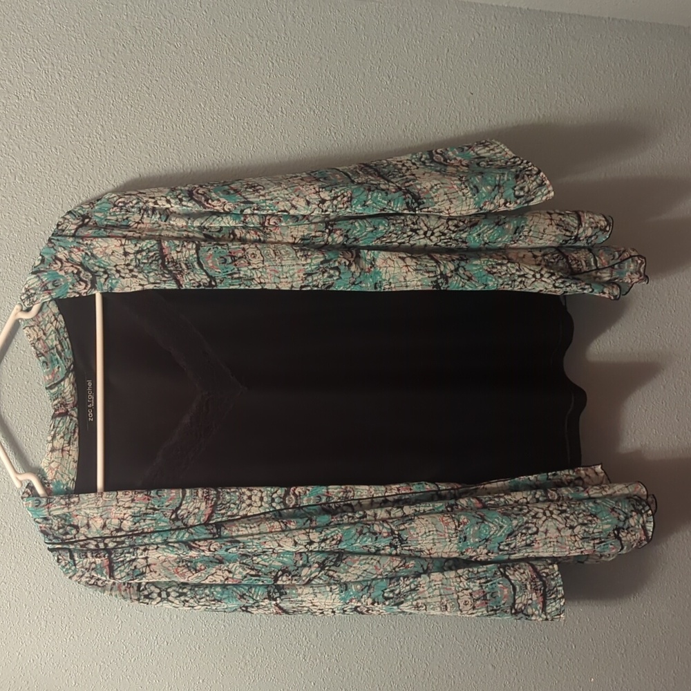 Women's blouse with attached cami.